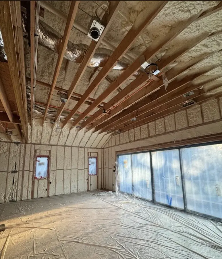 Interior walls and ceiling insulated with spray foam during new construction in Longmeadow